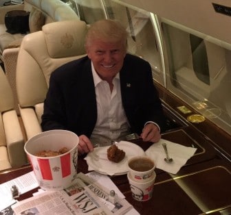 Trump aboard his jet with a bucket of KFC