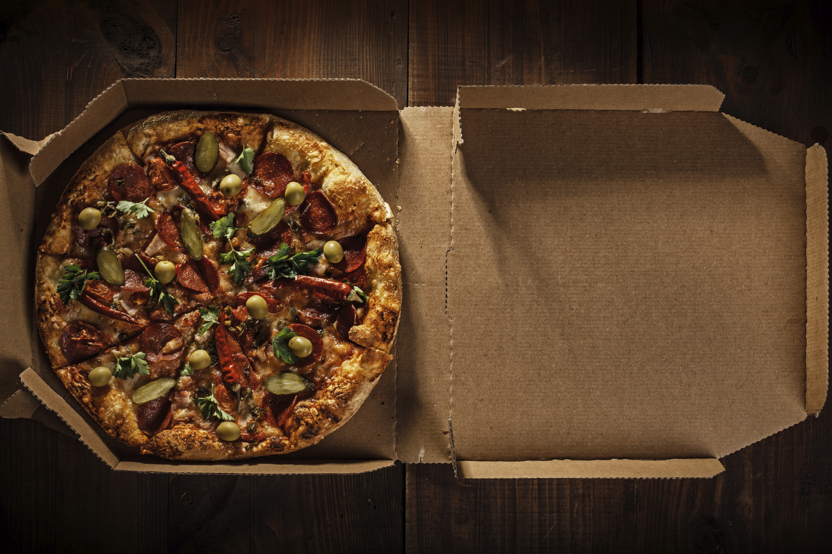 Pizza delivery boxes contain toxic chemicals that have been banned by the FDA.