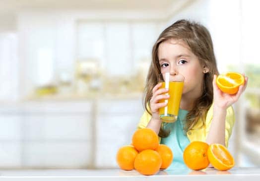 Girl Child Drinking OJ