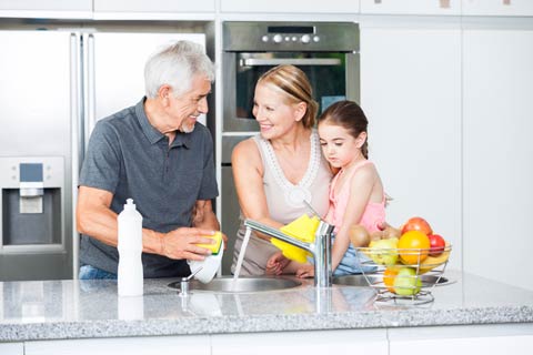 Grandparents and washing dishes with Granddaughter