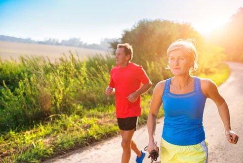 Senior couple running