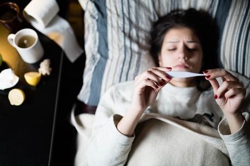 Girl in bed with flu