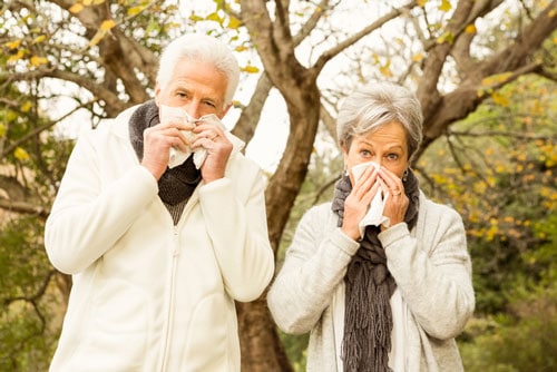 Couple Blowing Nose