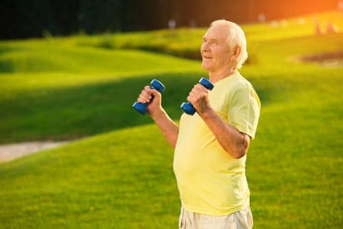 Senior w/ dumbbells