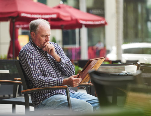 Man Reading Germy Menu