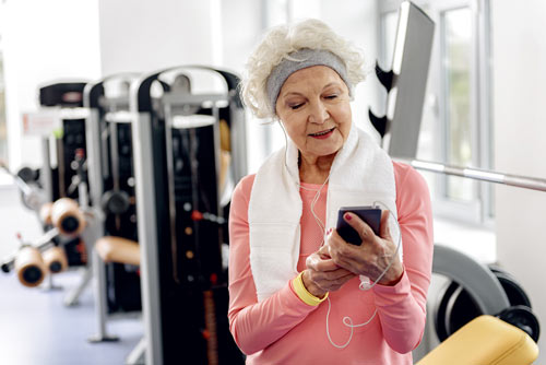 Lady Listening to music at gym