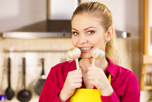 woman holding garlic