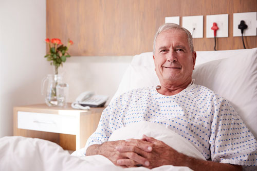 man in hospital bed