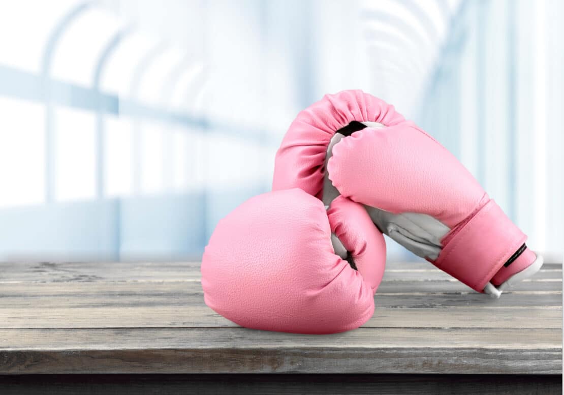 Picture of pink boxing gloves. Symbolic to beating breast cancer.