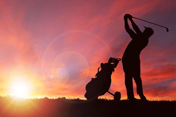 Photo of person playing golf.