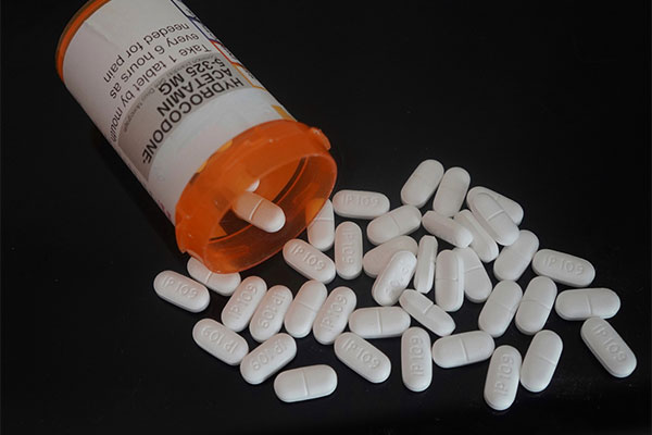 Photo of prescription bottle and pills.