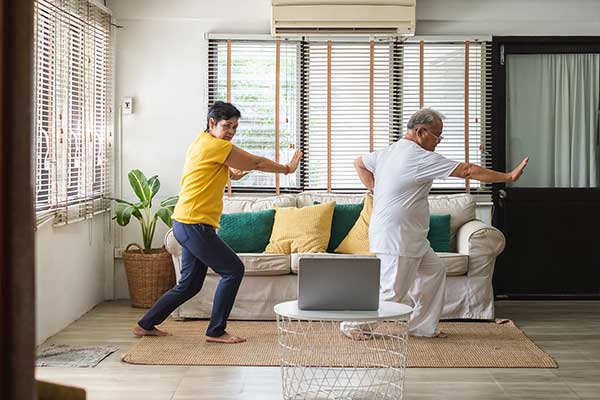 Photo of two people practicing Tai Chi