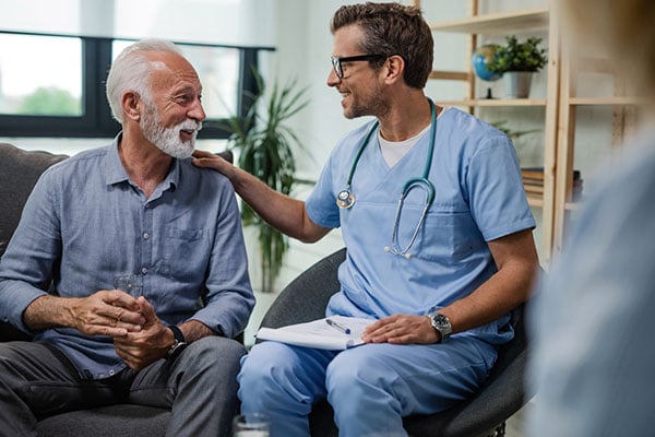 Doctor and patient sitting side by side.