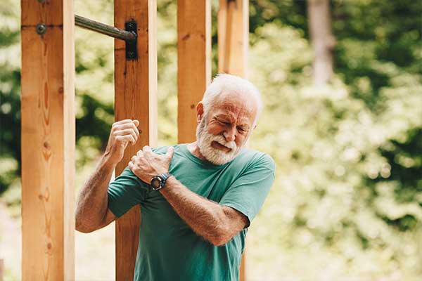 Man swinging shoulder.