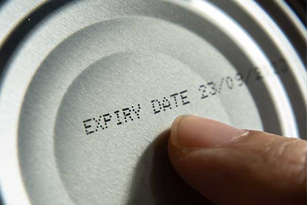 Zoom in on a expiration date on a can of food.