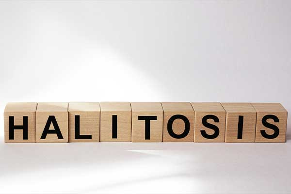 Type of the word "Halitosis spelled out and zoomed in on and framed.