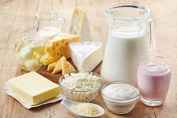 Picture of dairy products sitting on a table.