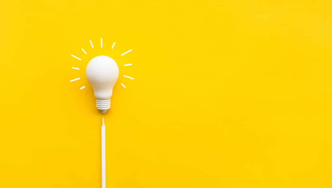 Picture of a lightbulb against a yellow background.