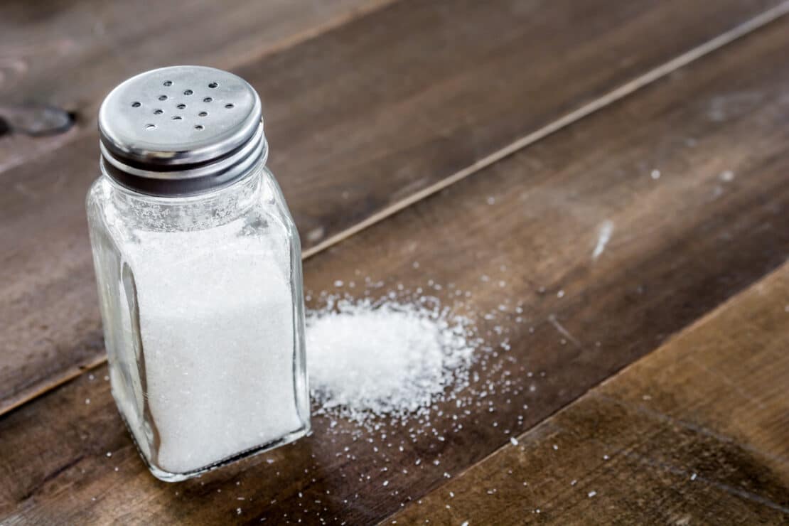 container of salt on a table