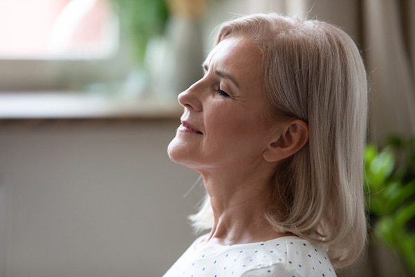 Image of woman calm with eyes closed.