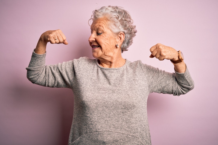 Photo of woman flexing her muscles