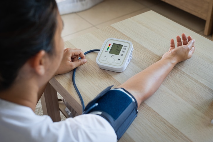 Photo of person taking their blood pressure